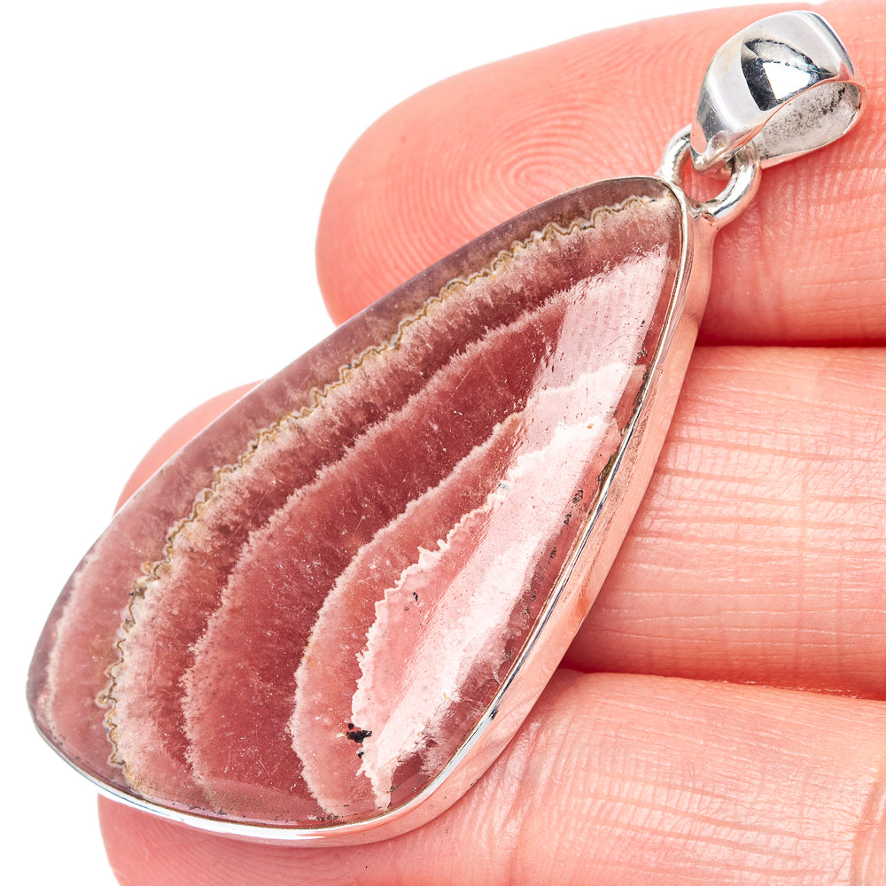 Teardrop rhodochrosite pendant in 925 sterling silver, close-up of pink banded stone