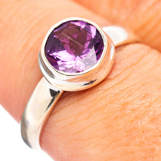 Amethyst sterling silver ring with oval purple gemstone bezel set