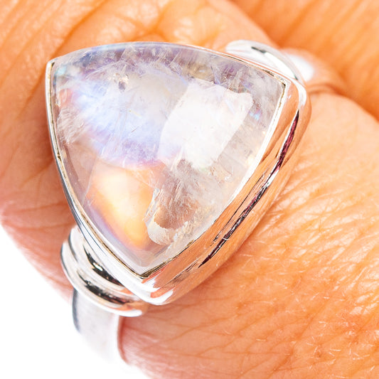 Sterling silver moonstone ring with pear-cut opalescent stone, open bezel setting