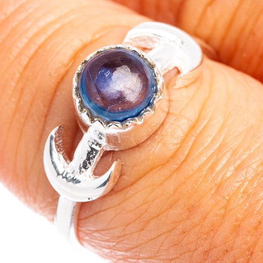 Sterling silver ring with bezel-set blue kyanite round stone and open, sculpted band