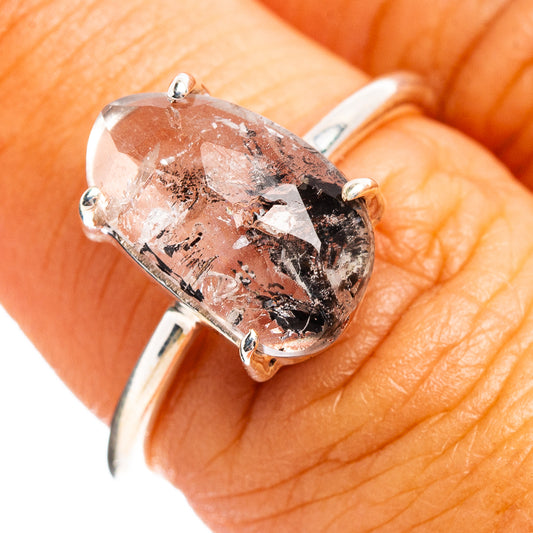 Faceted cacoxenite ring in .925 sterling silver, oval clear stone with dark inclusions