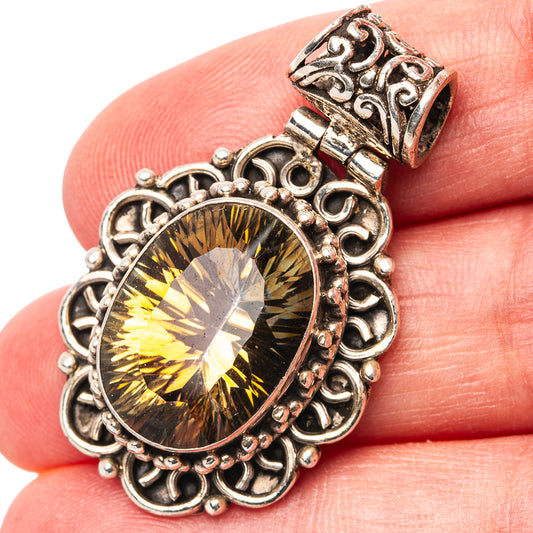 Sterling silver oval topaz pendant with ornate filigree setting, yellow-gold gemstone