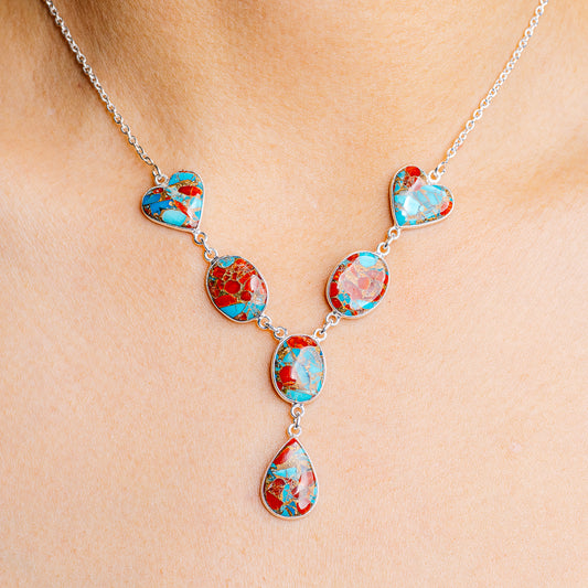 Coral and turquoise matrix heart pendant necklace with silver-tone chain and charms