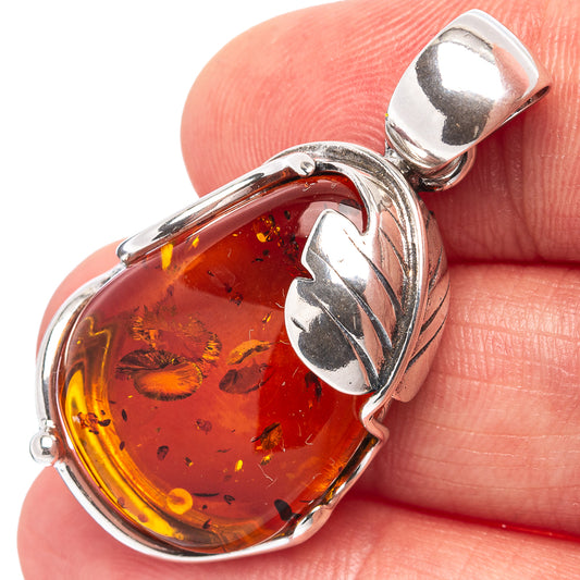 Amber leaf pendant in .925 sterling silver with oval baltic amber cabochon