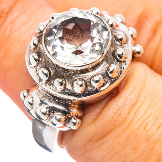 White topaz style round stone sterling silver ring with raised bezel and bead details
