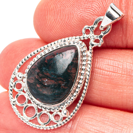 Teardrop moss agate pendant in sterling silver with bead trim and round cutouts