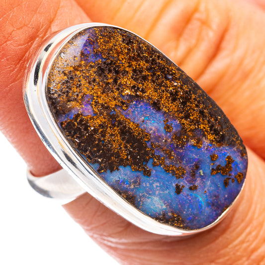 Sterling silver oval boulder opal ring with blue and brown stone, rounded bezel