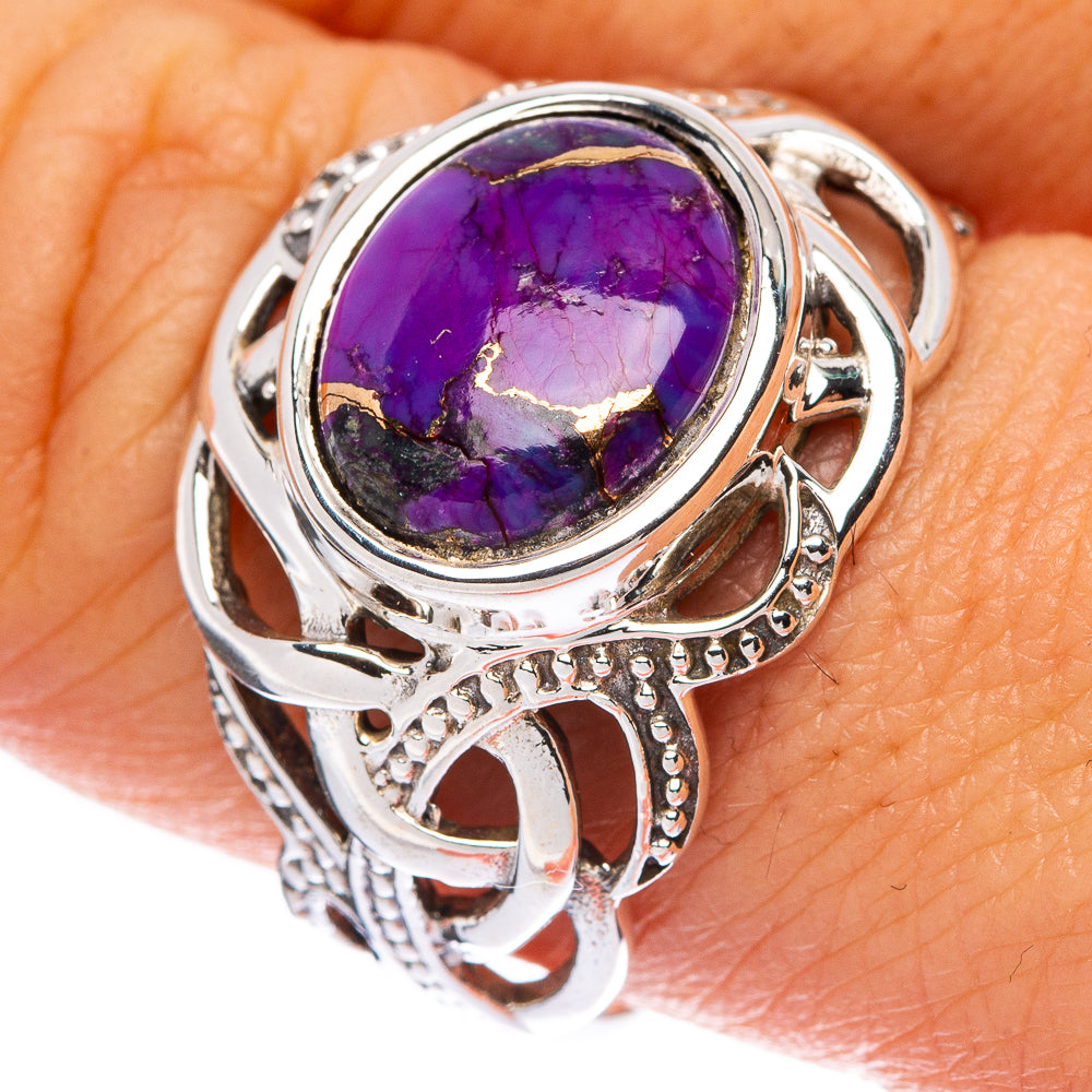Sterling silver ring with oval purple gemstone and ornate openwork band