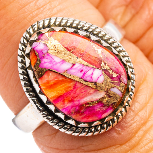 Sterling silver ring with oval gemstone in pink, purple, and orange with beaded border