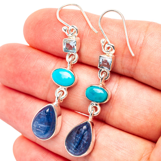 Sterling silver drop earrings with square blue stones, turquoise ovals, and blue teardrops