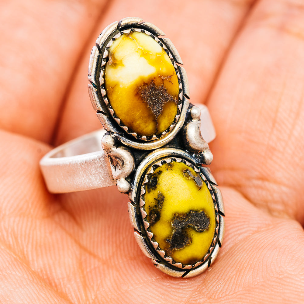 Sterling silver adjustable ring with two oval amber-yellow cabochon stones, front view