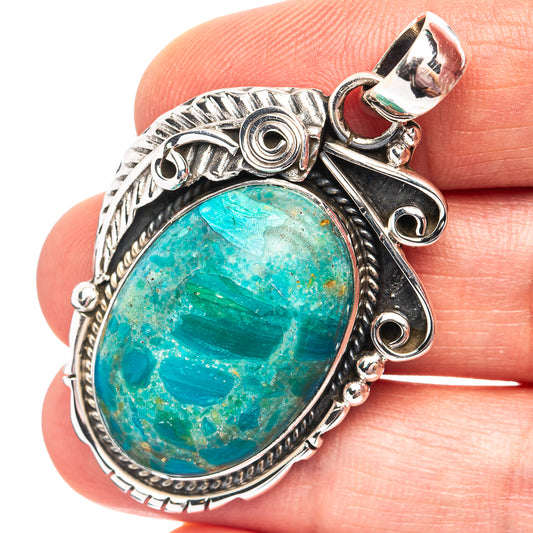 Oval blue-green opal pendant in ornate .925 sterling silver setting with bail