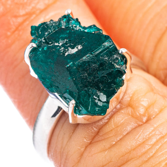 Sterling silver ring with rare dioptase green gemstone, prong-set on a wide band.