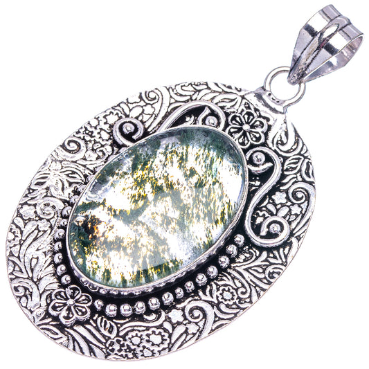 German silver moss agate oval pendant with filigree bezel, split bail; green-gold cabochon