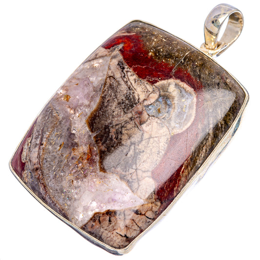 Sterling silver pendant with mottled rhyolite stone, rectangular bezel and bail loop