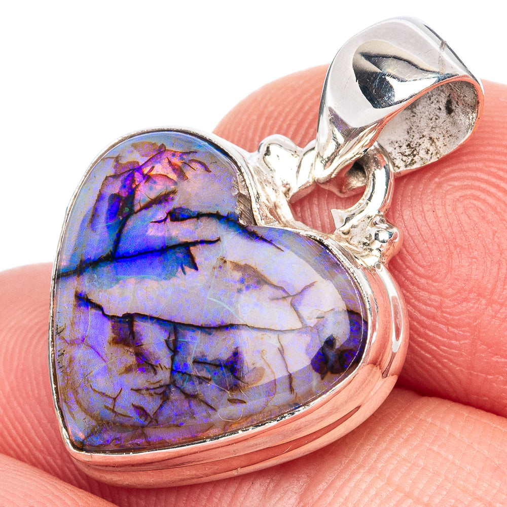 Sterling silver heart pendant with iridescent blue-purple opal center and bail