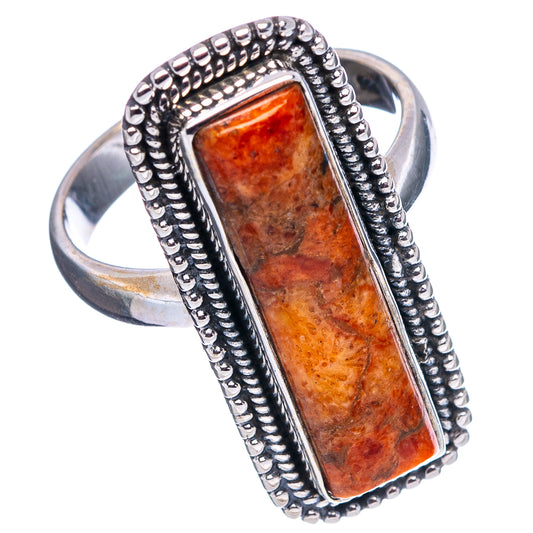 Sterling silver ring with bezel-set rectangular orange sponge coral stone and rope border