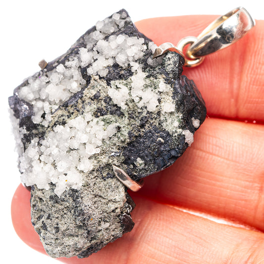 Sterling silver pendant with rough white quartz crystal cluster on dark blue sphalerite