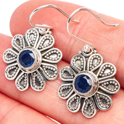 925 sterling silver snowflake earrings with blue round centers and ornate petal detailing