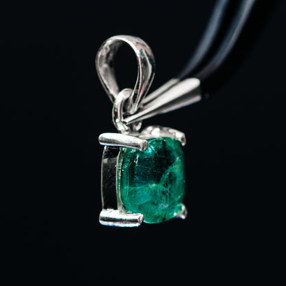 Sterling silver pendant with emerald-green cushion-cut stone and open setting prongs