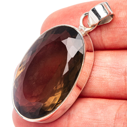 Faceted smoky quartz oval pendant in .925 sterling silver with top bail