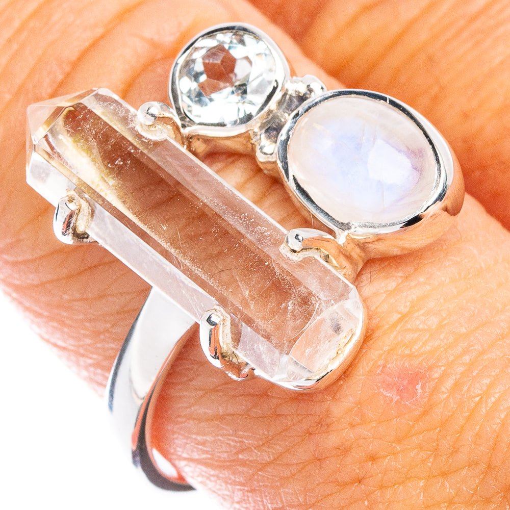 Sterling silver ring with oval white moonstone and clear quartz point setting