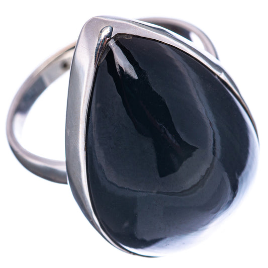 Sterling silver ring with black teardrop obsidian cabochon, angled close-up