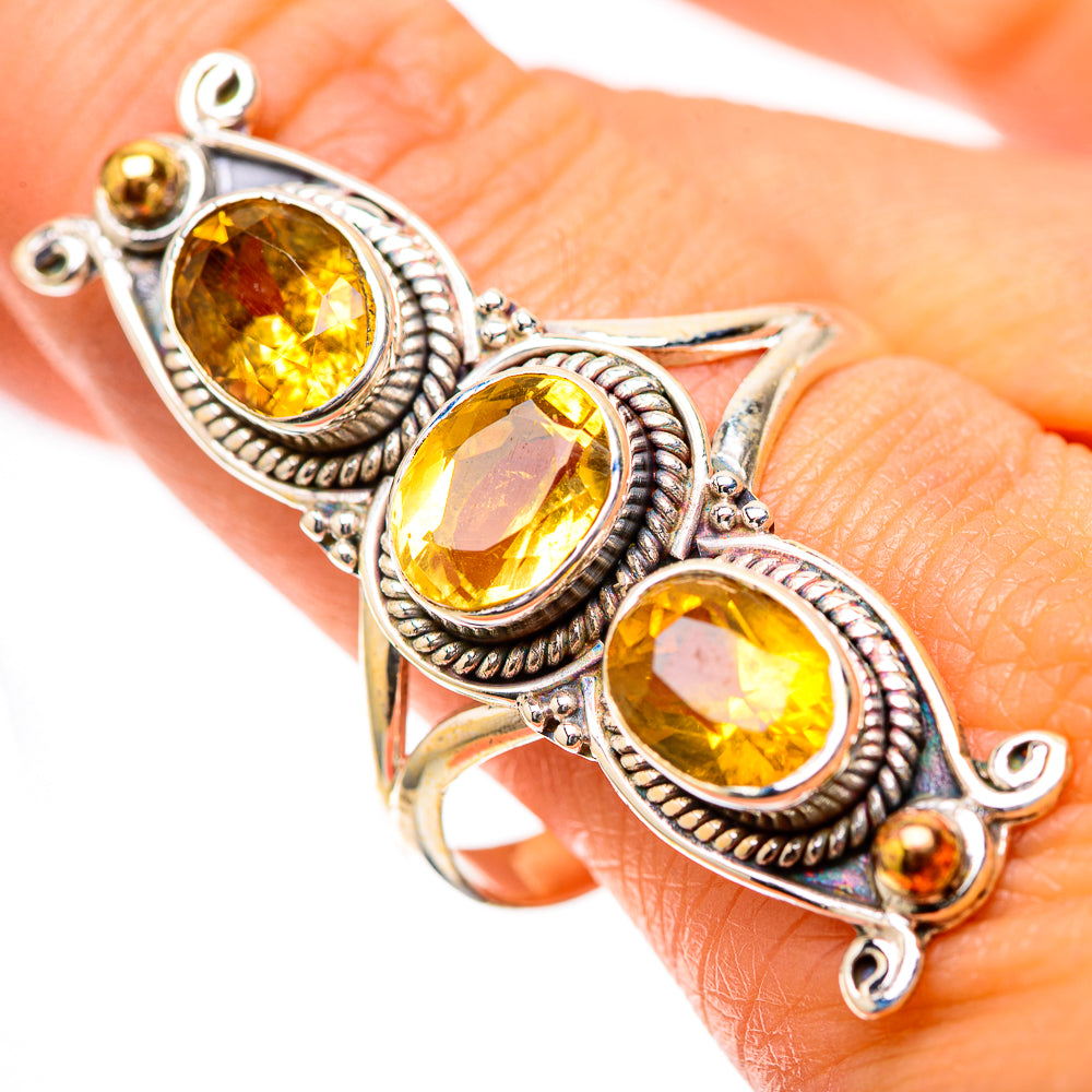 Sterling silver citrine ring with three faceted oval stones and decorative prongs