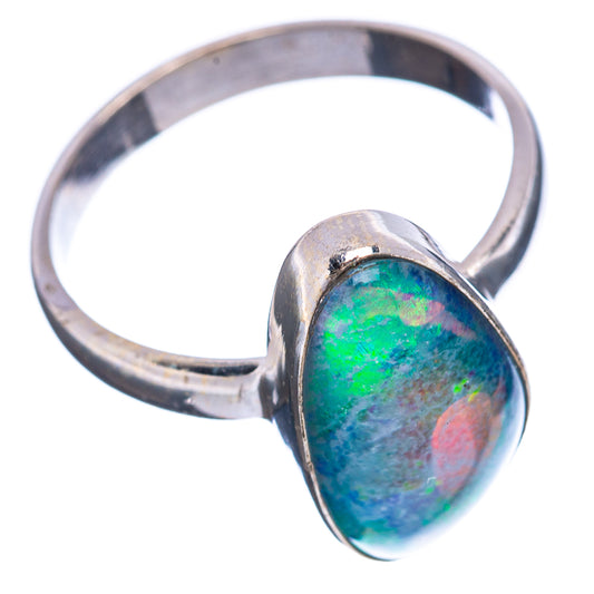 Sterling silver ring with oval blue-green opal centerpiece, side view