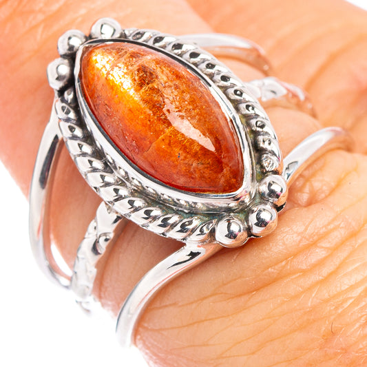 Oval orange sunstone ring in .925 sterling silver with ornate bezel and small round posts