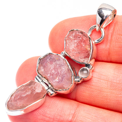 Sterling silver pendant with three rough pink rose quartz stones in bezel settings