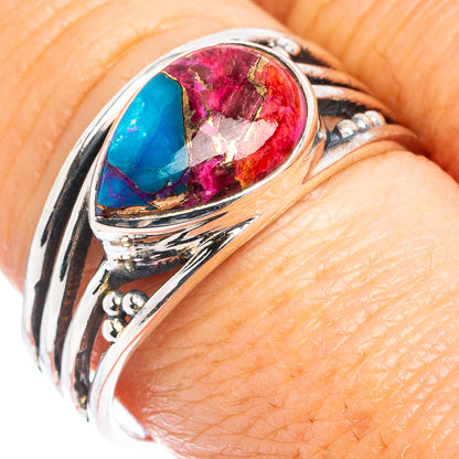 Sterling silver ring with pink and blue oval gemstone cabochons, ornate carved band