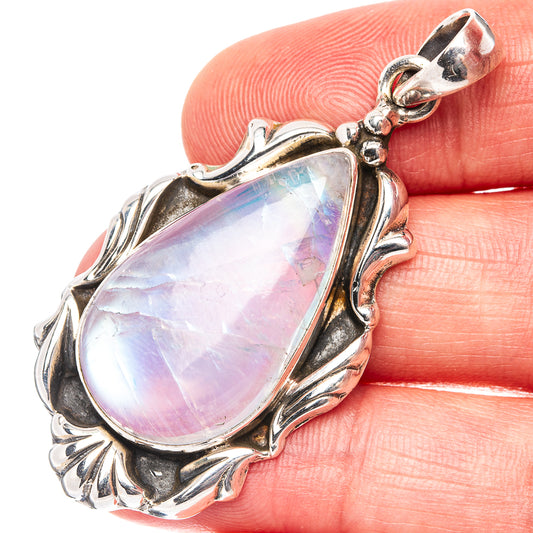 Teardrop rainbow moonstone pendant in ornate .925 sterling silver bezel, prismatic glow