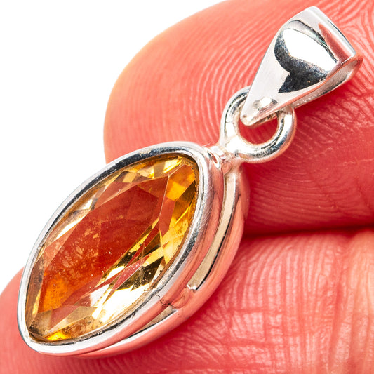 Sterling silver citrine pendant close-up with oval faceted gemstone and bail