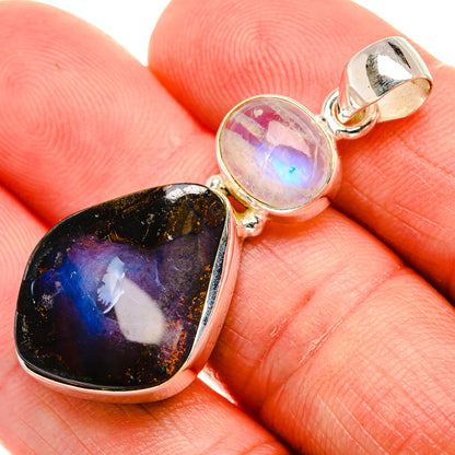 Sterling silver pendant with oval boulder opal and round rainbow moonstone cabochon