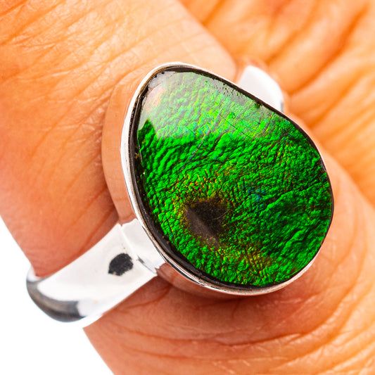 Sterling silver ring with oval iridescent ammolite cabochon, vivid green