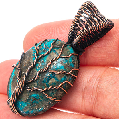 Turquoise tree-of-life pendant with oxidized copper wire wrap, round stone face
