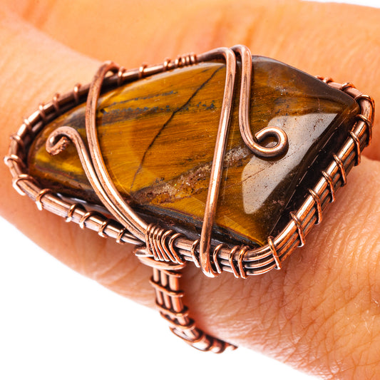Oxidized copper wire ring with tiger's eye teardrop stone, on finger view