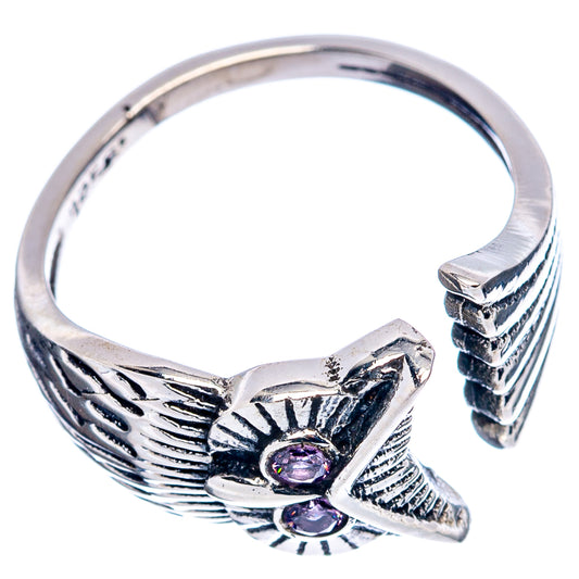 Sterling silver owl ring with carved wing details and two purple amethyst stones