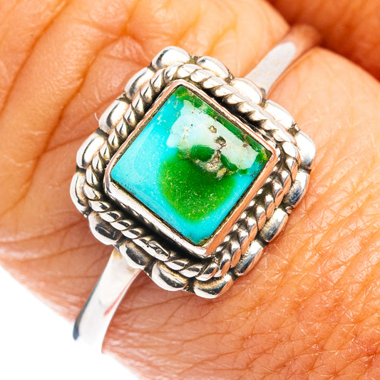 Dainty sterling silver ring on finger with square turquoise-green stone and braided frame; size 9
