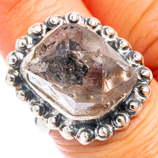 Sterling silver ring with faceted crystal bezel and bead-like silver border