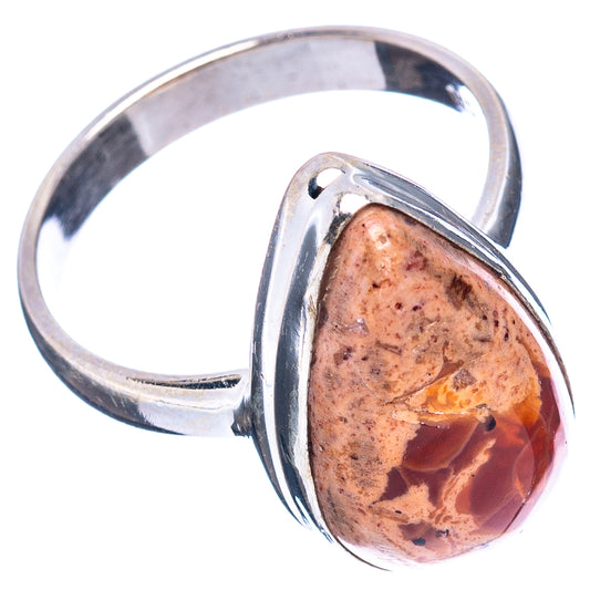 Sterling silver ring with oval fire opal cabochon in raised bezel frame