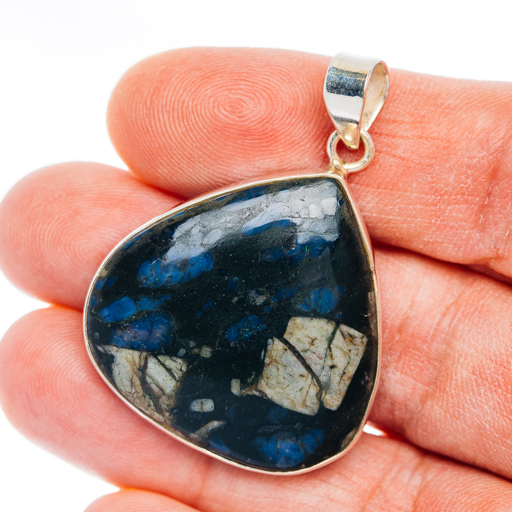 Que Sera sterling silver teardrop pendant with blue, veined stone center