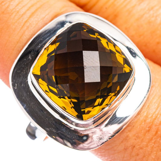 Sterling silver ring with faceted olive quartz oval center stone, polished bezel