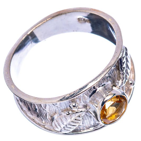 Sterling silver ring showing round citrine stone and engraved floral texture on band