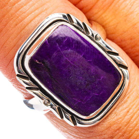 Sterling silver ring with rectangular purple sugilite cabochon and ornate raised bezel