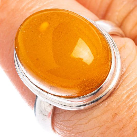 Sterling silver amber cabochon ring with oval honey-yellow stone