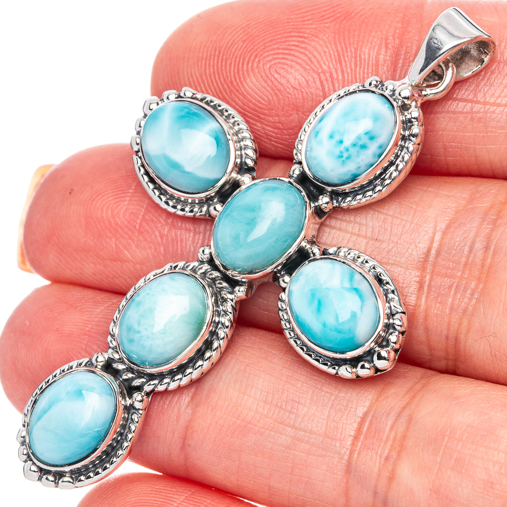 Sterling silver cross pendant with five oval larimar turquoise stones and top bail