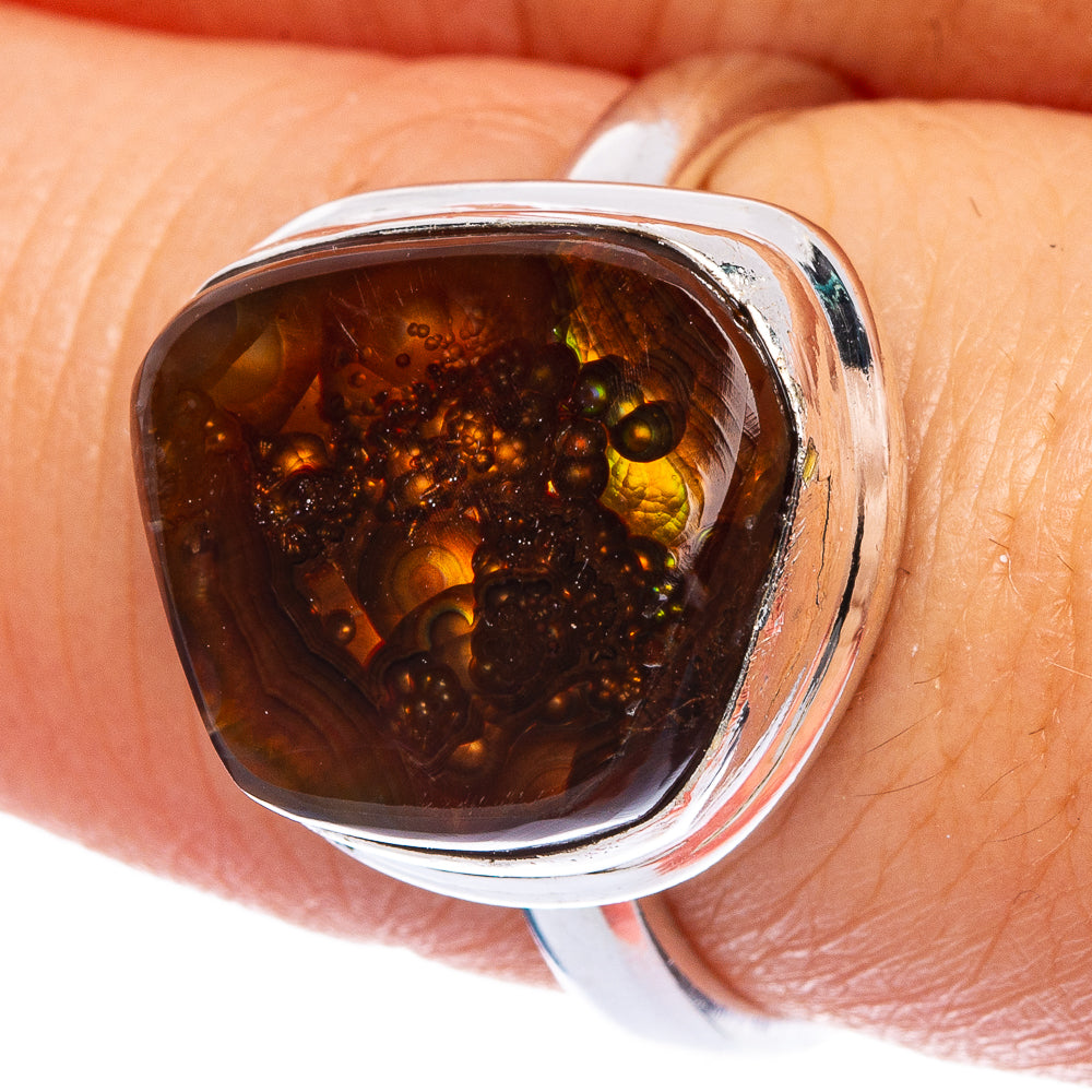 Sterling silver ring with dark amber fire agate teardrop bezel