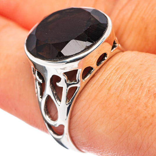Smoky quartz ring in sterling silver with faceted dark oval stone and cutout band